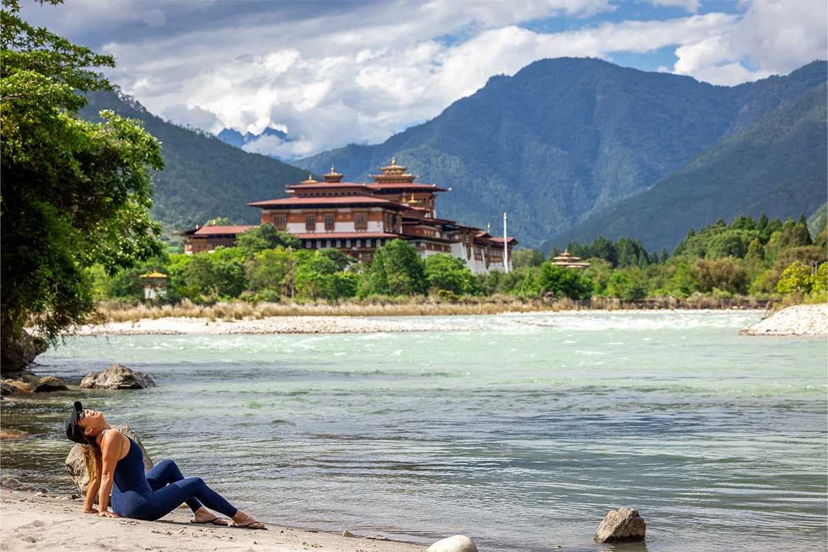 A solo traveller in Bhutan, walking with her guide