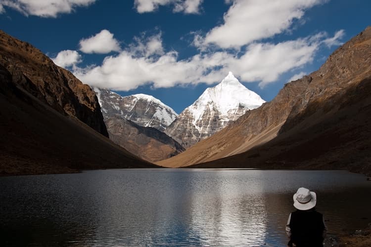 Chomolhari (7,326 m) from the Jangothang base camp at dawn, with trekkers' tents in the foreground