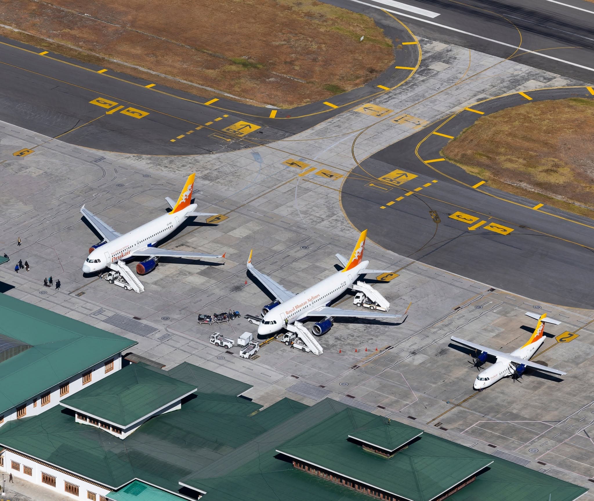 Drukair and Bhutan Airlines aircraft on the apron at Paro International Airport