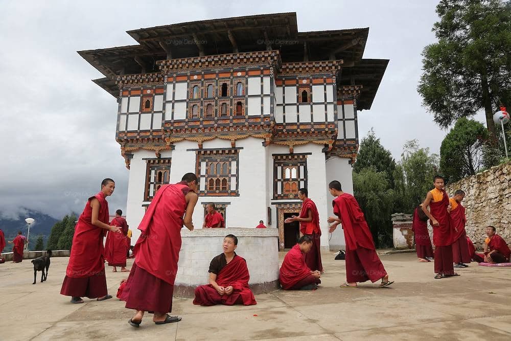 Young monks in the courtyard of a Bhutanese Buddhist college — the world the film is set in